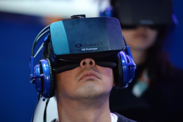 A man uses a prototype Oculus Rift at the Consumer Electronics Show in 2014