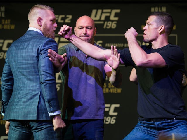 Nate Diaz (right) confronts Conor McGregor at the pre-fight press conference