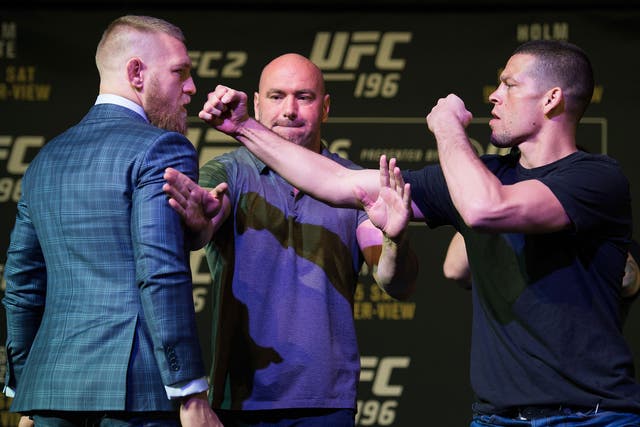 Nate Diaz (right) confronts Conor McGregor at the pre-fight press conference