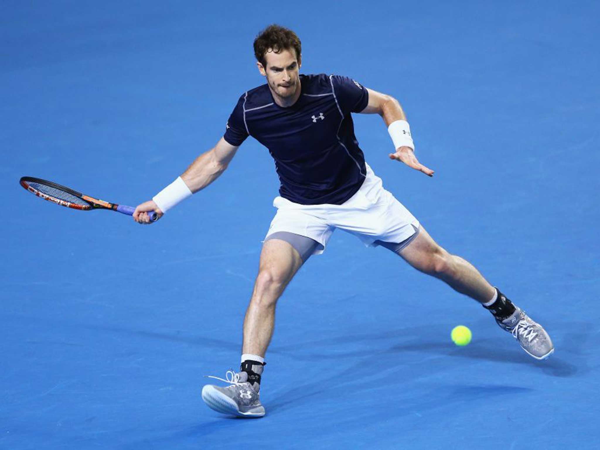 Andy Murray stretches for a forehand in his singles match against Taro Daniel of Japan during day one of the Davis Cup