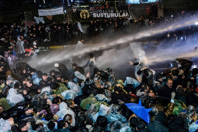 Turkish riot police use water cannon and tear gas to disperse supporters at Zaman daily newspaper headquarters