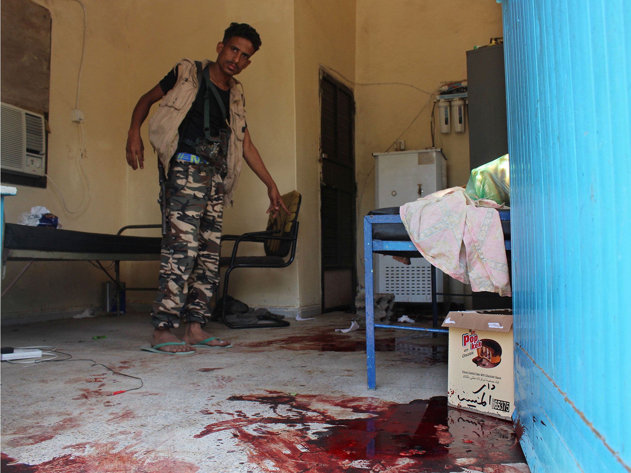 A Yemeni man inspects an elderly care home after it was attacked by gunmen in the port city of Aden, Yemen, Friday, 4 March, 2016.