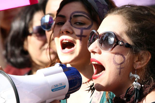 Turkish women shout slogans during a rally to mark International Women's Day in Ankara, on March 8, 2015.