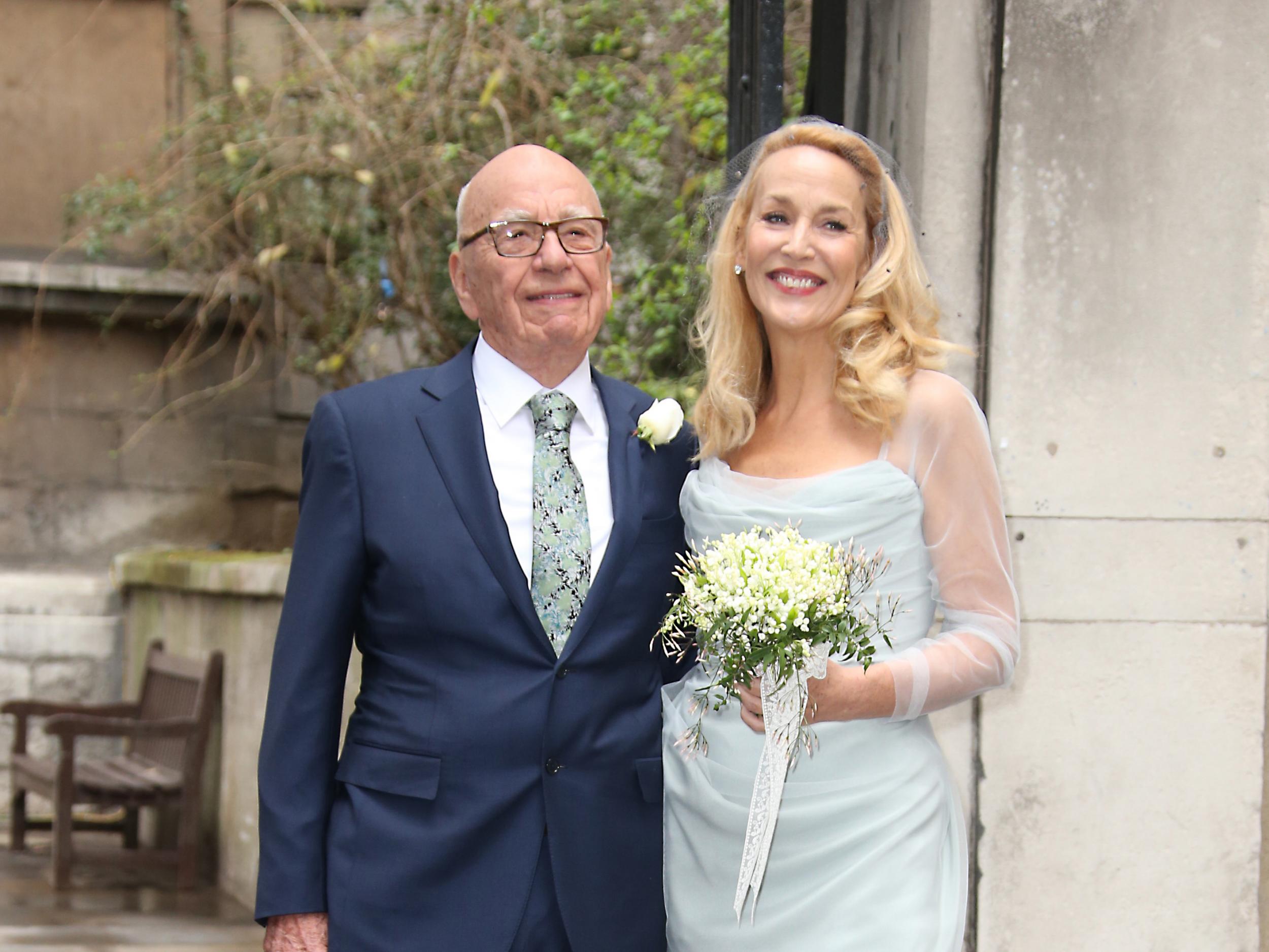 Murdoch and Hall leave St Bride's Church following their ceremony