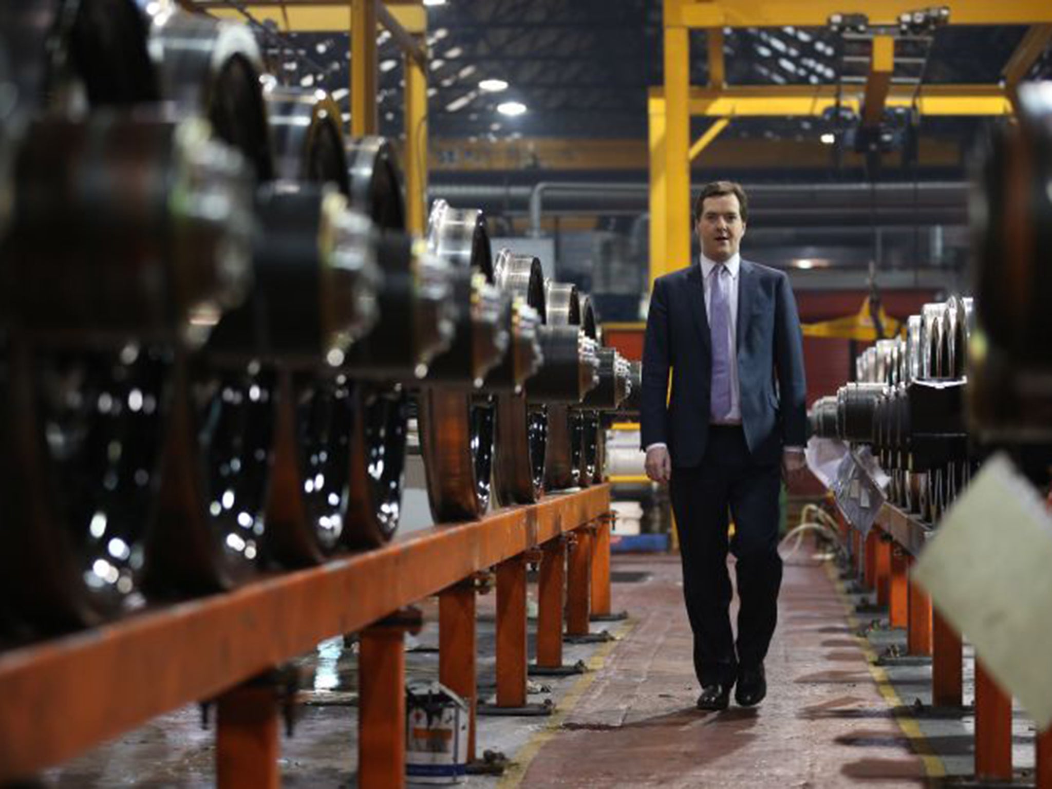 Chancellor George Osborne takes part in a tour of the train wheel manufacturers Lucchini UK, in Manchester, in 2013. The first phase of HS2 opens in 2026