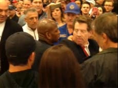 Video: KKK protester tries to bite way out of Trump rally after attack