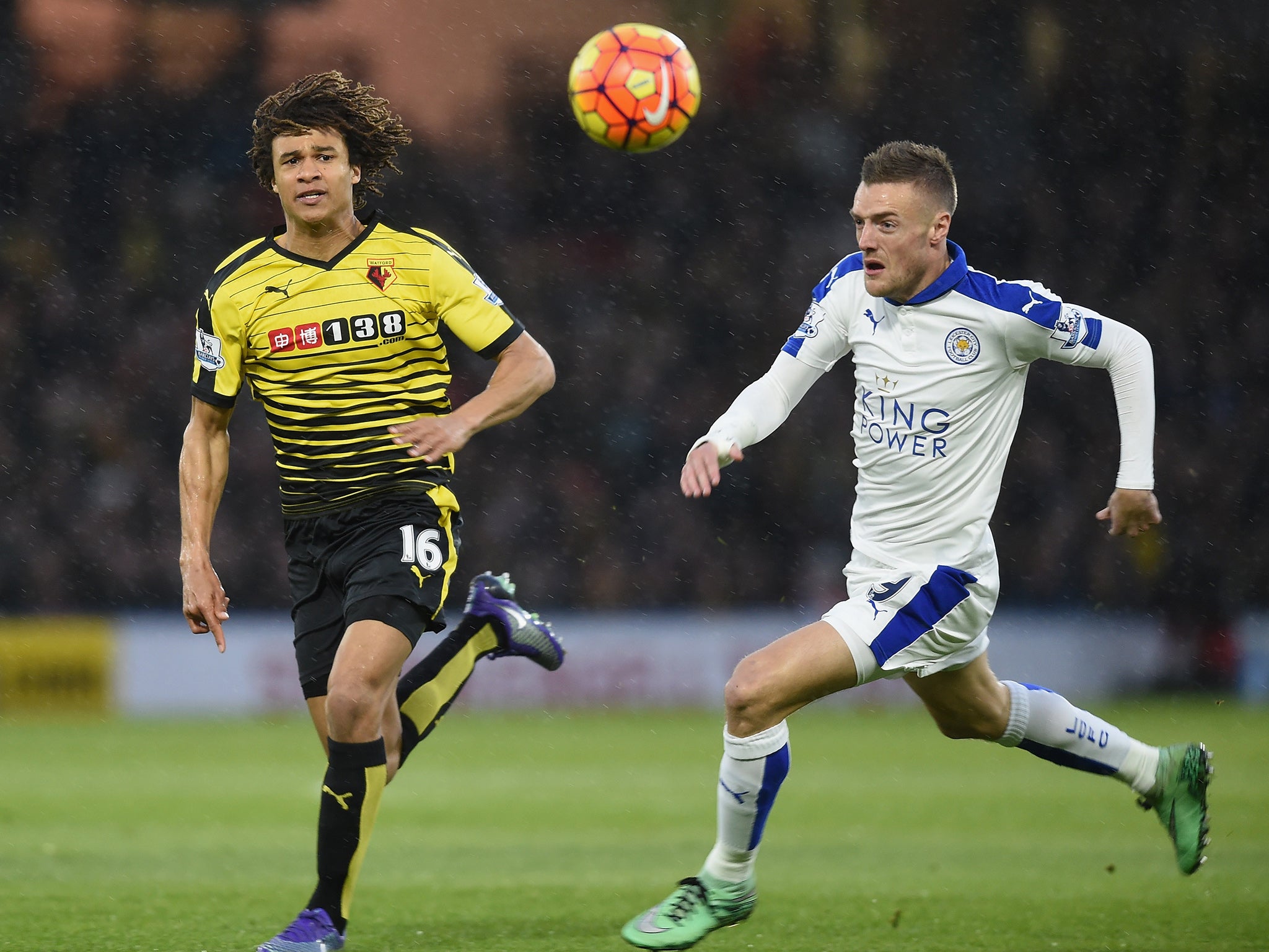 Watford's Nathan Ake and Leicester's Jamie Vardy vie for the ball
