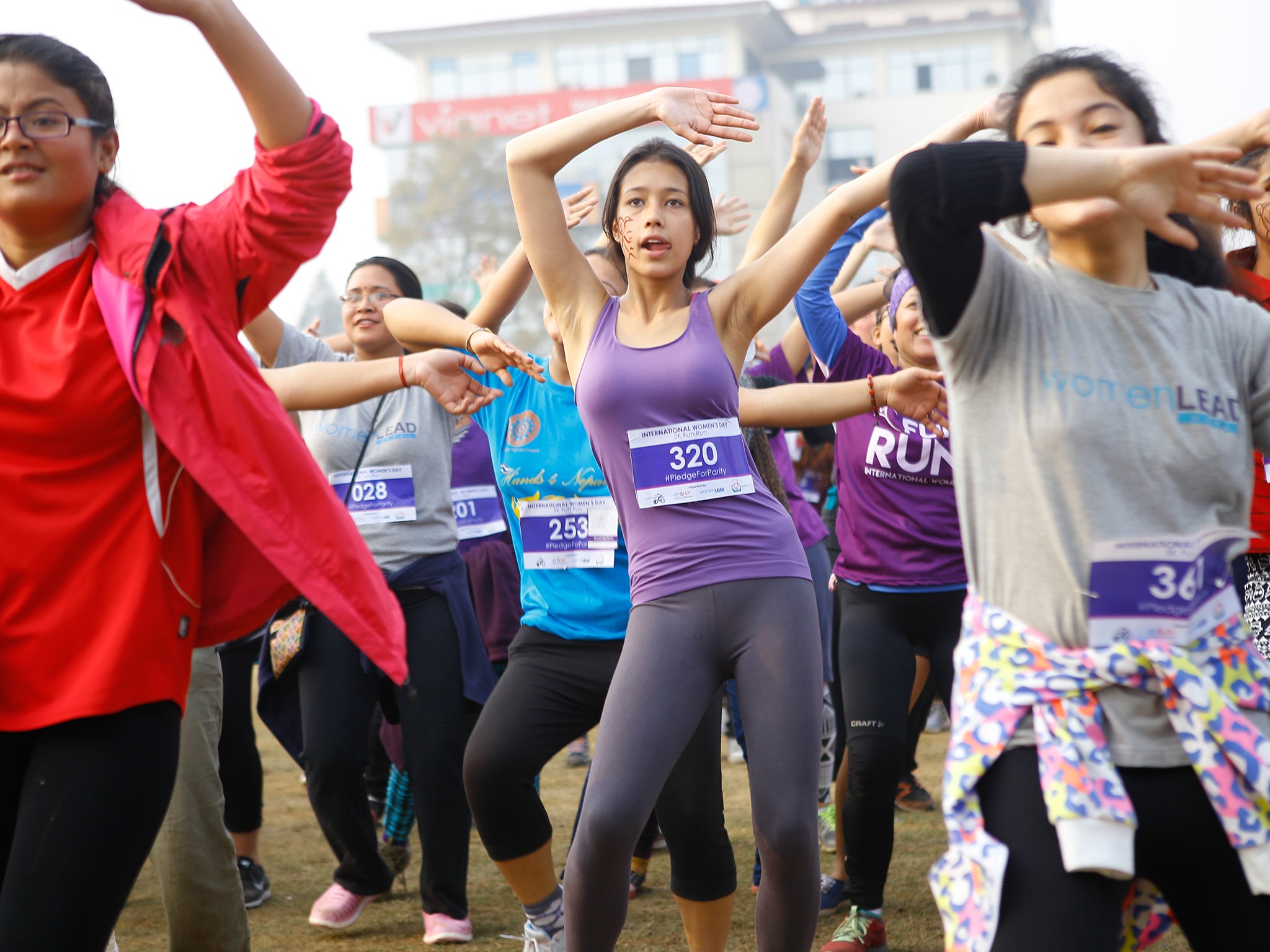 Nepalese women enjoy some Zumba dance after completing a fun-run to celebrate International Women's Day near Kathmandu