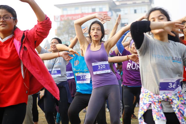 Nepalese women enjoy some Zumba dance after completing a fun-run to celebrate International Women's Day near Kathmandu