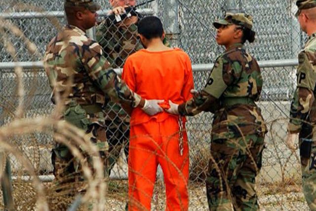 A prisoner is taken for questioning at Guantanamo