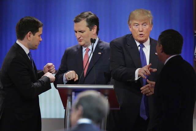Republican presidential candidates greet each other following a debate sponsored by Fox News at the Fox theatre on March 3, 2016 in Detroit, Michigan