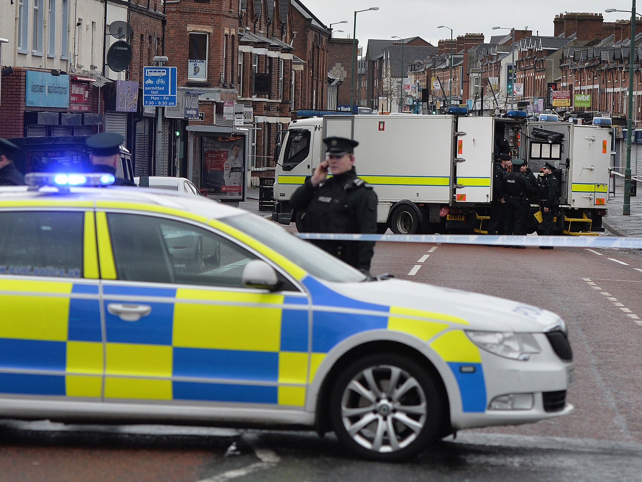 PSNI officers on Hillsborough Drive in Belfast - Sunday's discovery came just over 24 hours after a prison officer was badly injured when a dissident republican car bomb detonated under his van in Belfast