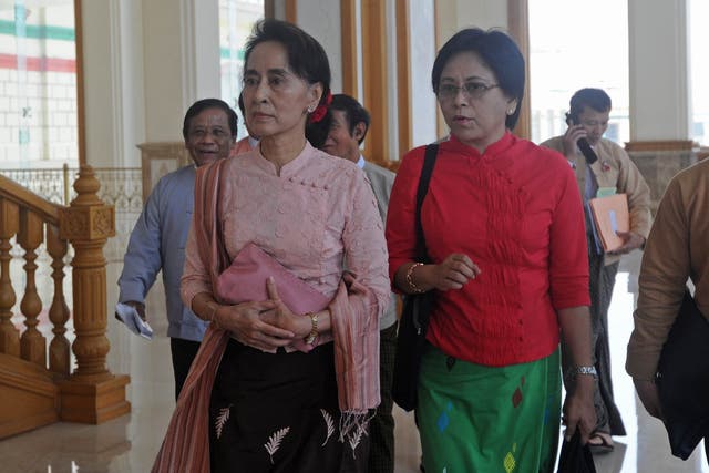 Double trouble: Aung San Suu Kyi’s companion Daw Tin Mar Aung (right) is unlikely to curb Burma’s anti-Muslim Buddhist nationalists.