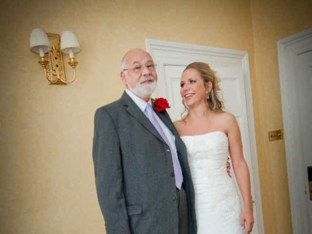 Emily and her father Kevin pose for a photo on her wedding day in 2011
