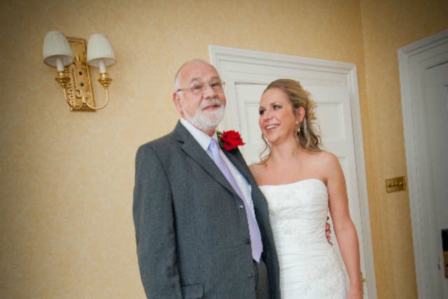 Emily and her father Kevin pose for a photo on her wedding day in 2011