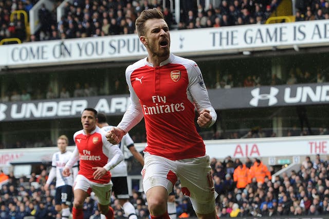Aaron Ramsey celebrates scoring against Tottenham for Arsenal