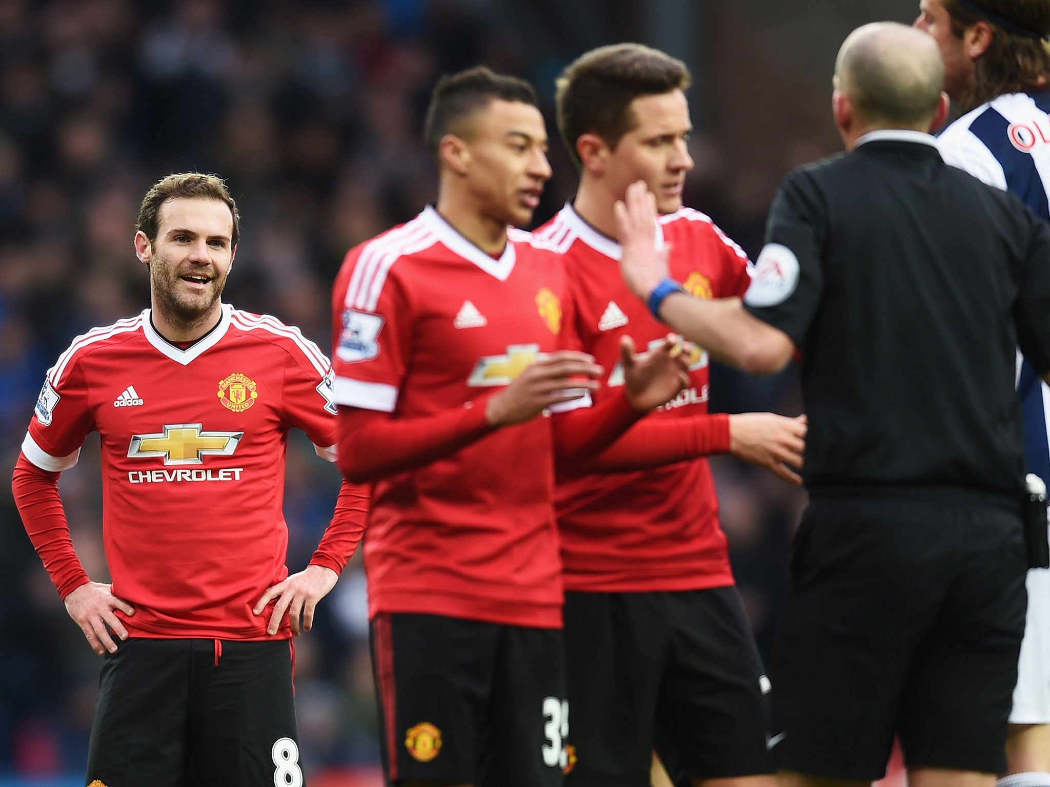 Juan Mata looks on after being sent-off against West Brom