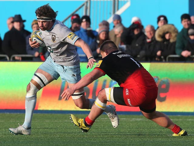 Tom Wood of Northampton Saints evades Saracens prop Richard Barrington