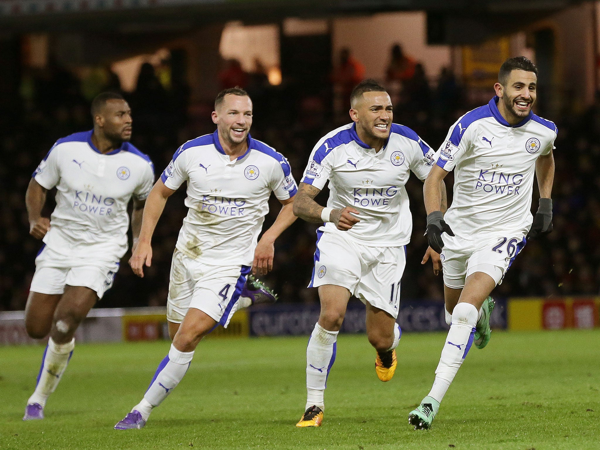 Riyad Mahrez, right, celebrates after scoring Leicester’s winner at Watford