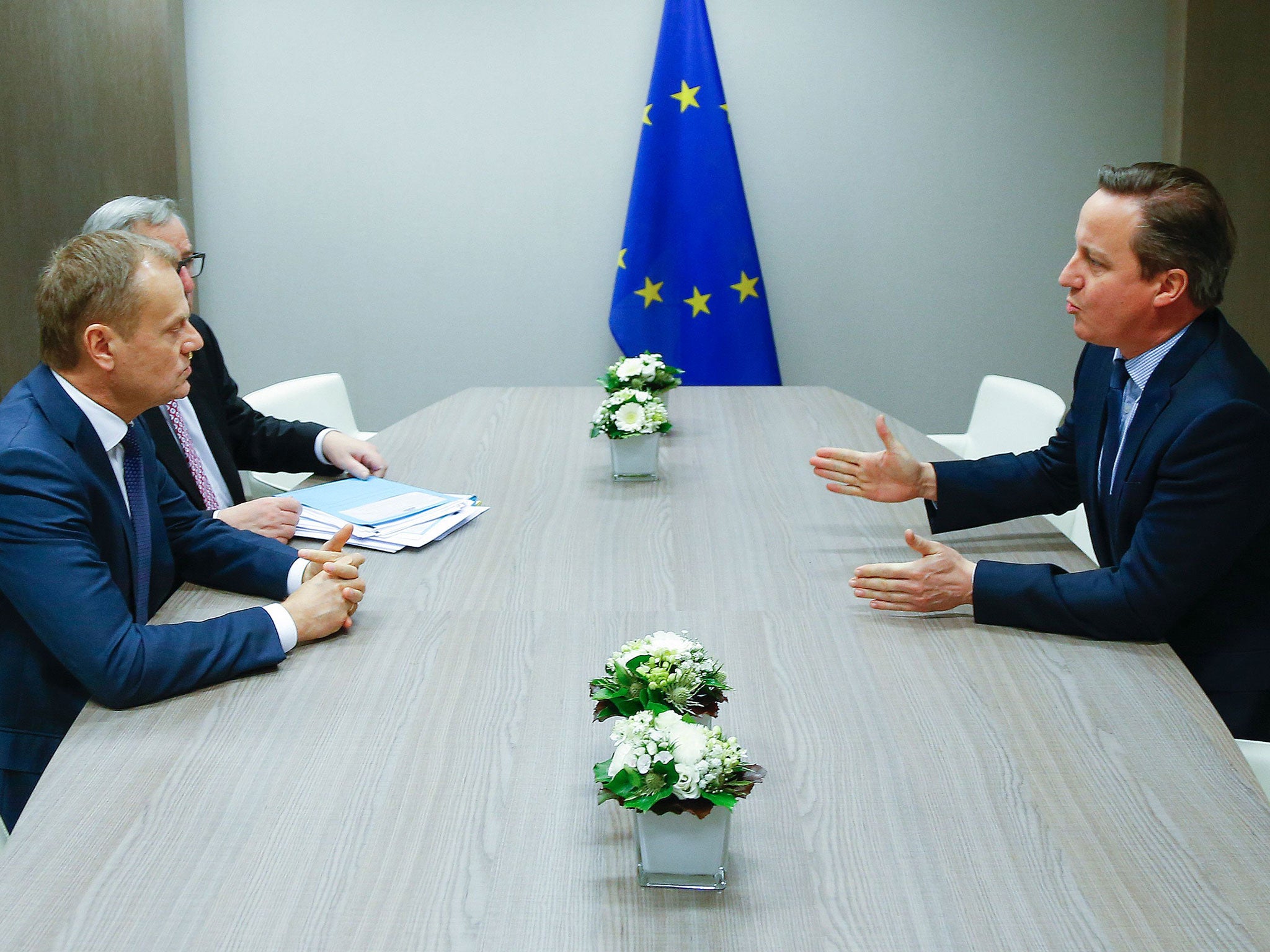 David Cameron, right, attends a meeting with and European Council President Donald Tusk, left, and European Commission President Jean Claude Juncker, center, during a European Union leaders summit