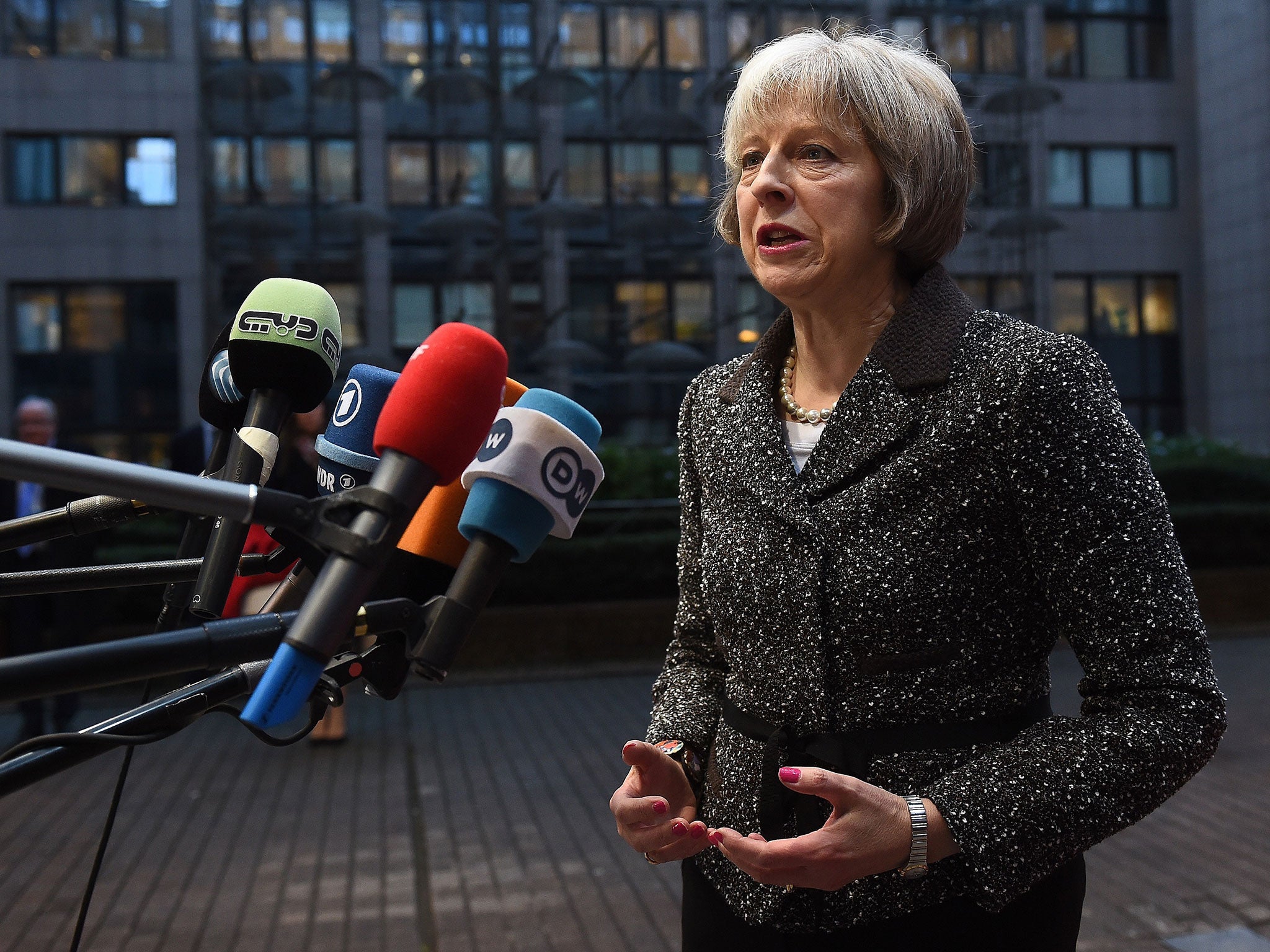 File: Home Secretary Theresa May speaks to the press in Brussels on 4 December, 2015