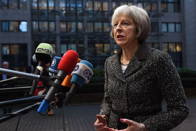 File: Home Secretary Theresa May speaks to the press in Brussels on 4 December, 2015
