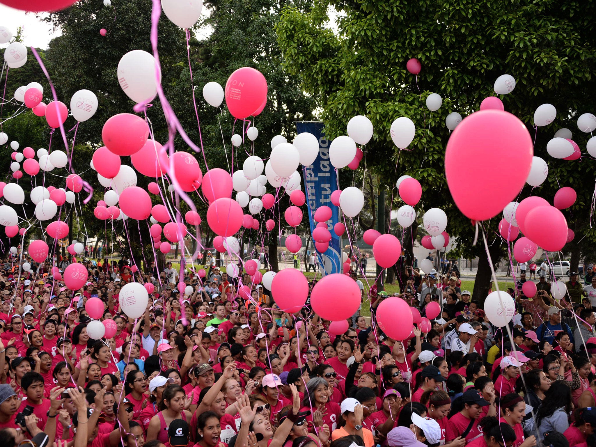 Women in Guatemala City take part in a run to raise awareness of breast cancer