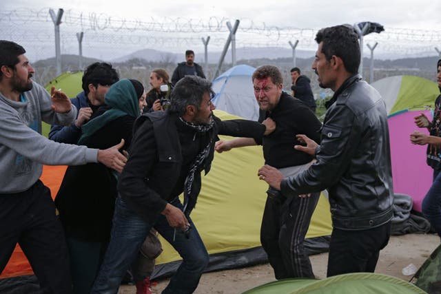 A fight breaks out between refugees in a camp at the Greek-Macedonian border near Idomeni, Greece
