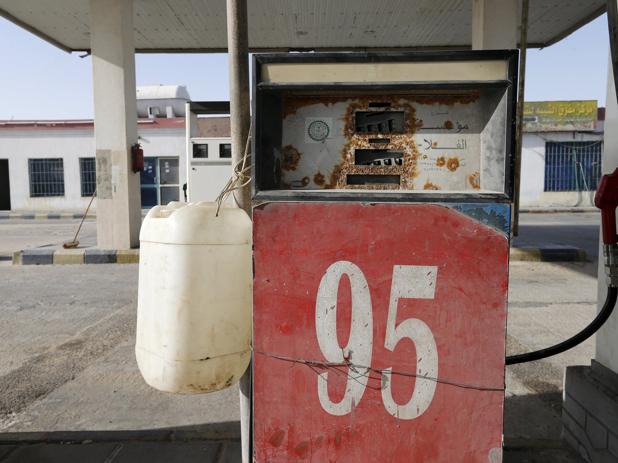An abandoned fuel pump in the desert village of Salwa, on the Qatar-Saudi border. Retail prices vary widely across the world because of the difference in taxes and subsidies