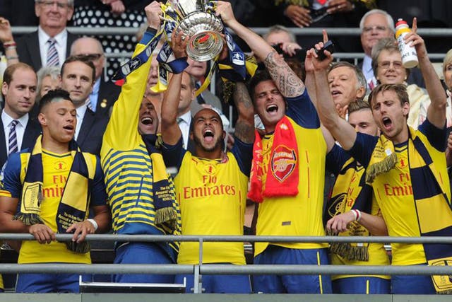 Arsenal lift the FA Cup at Wembley last May