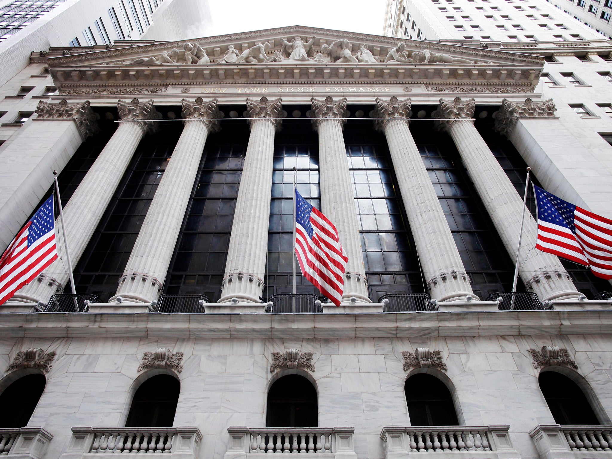 American flags fly in front of the New York Stock Exchange