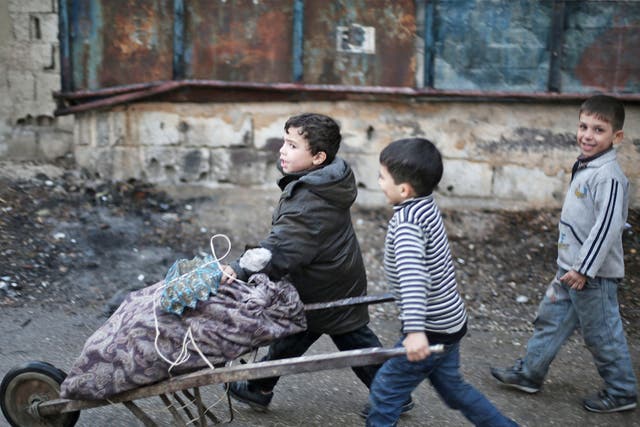 Children collecting firewood in in Eastern Ghouta, Syria