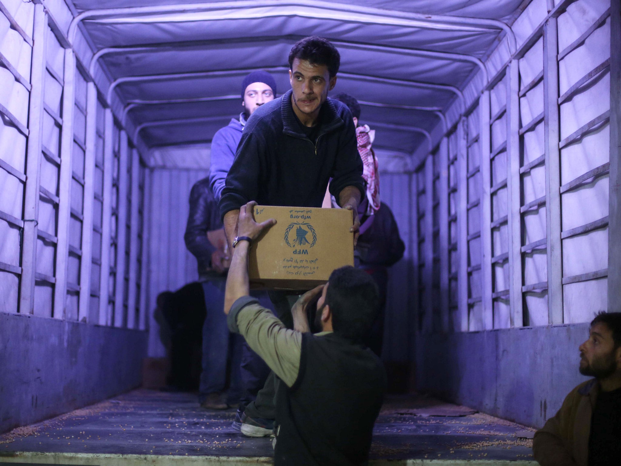 Aid being delivered to the rebel-held town of Ain Terma, on the outskirts of Damascus, at the weekend (Getty)