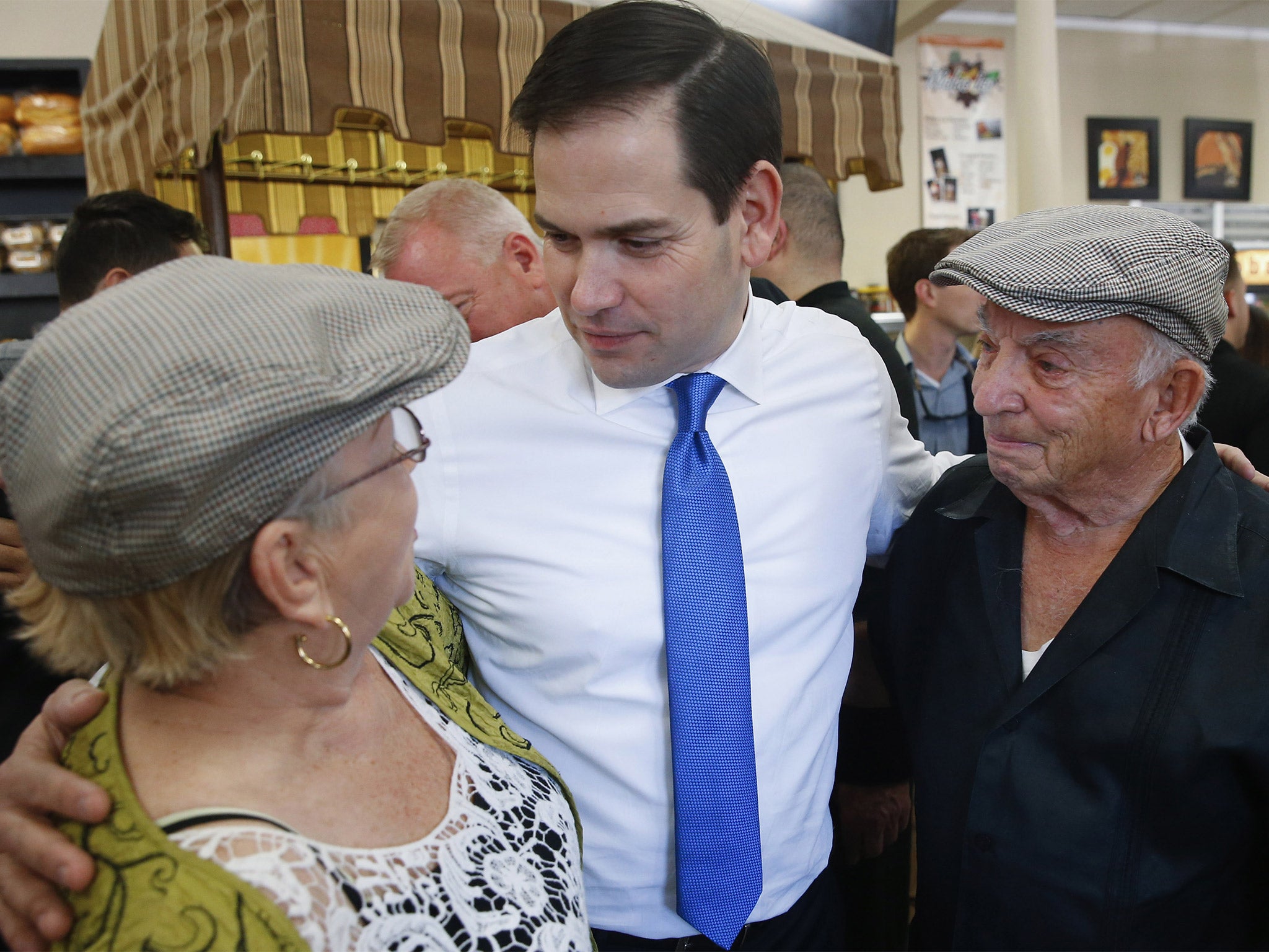 &#13;
Senator Marco Rubio speaks with patrons at the Melao Bakery in Kissimmee, Florida (AP)&#13;