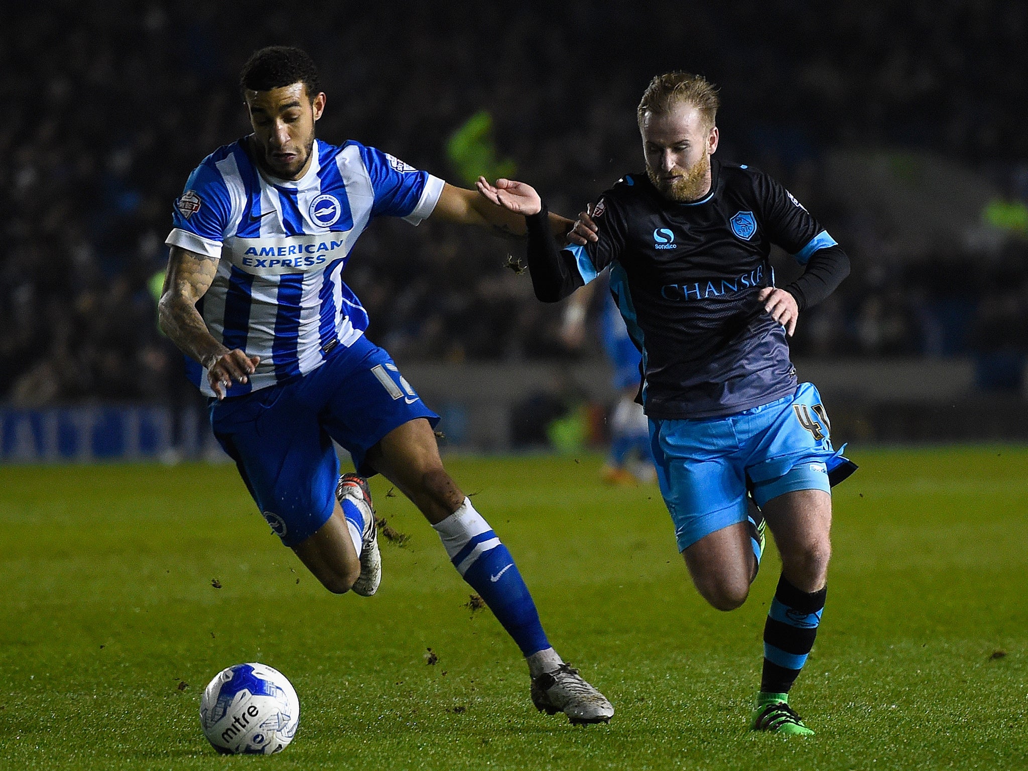 Connor Goldson holds off Barry Bannan