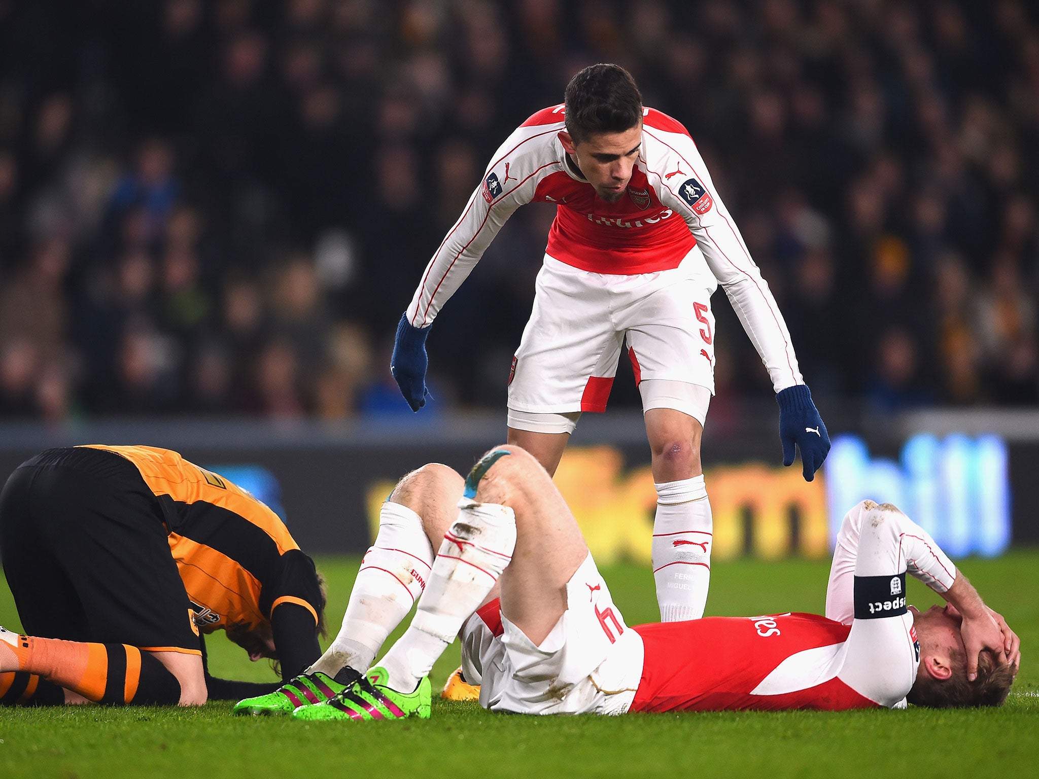 Per Mertesacker suffered a cut and a small concussion after a head clash with Nick Powell