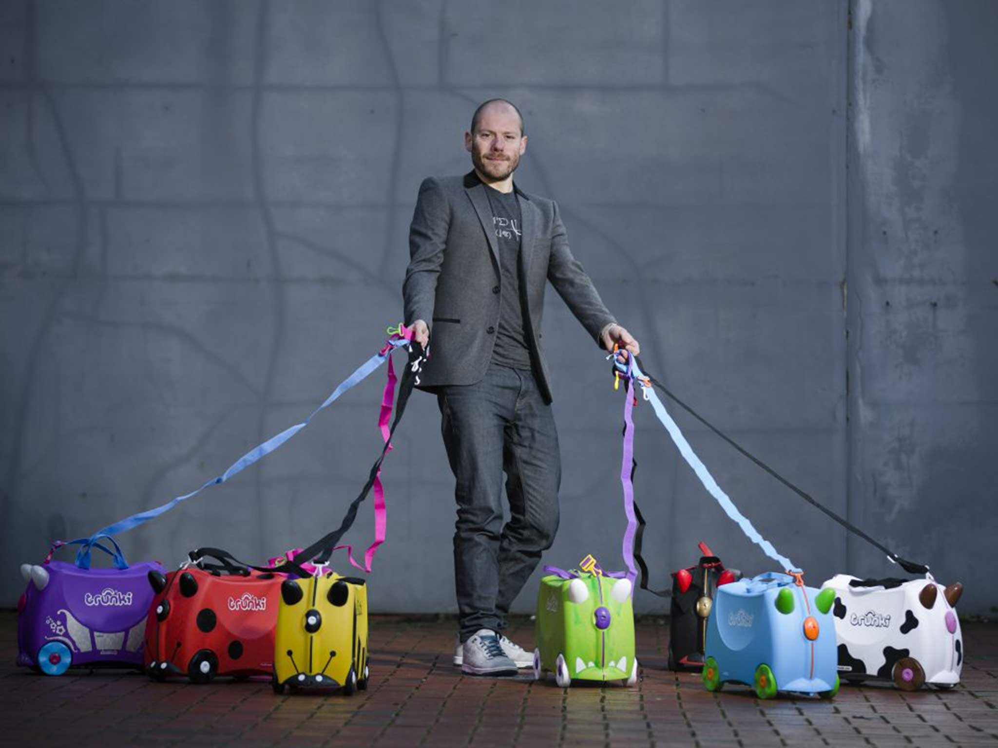 Trunki founder Rob Law with his creations