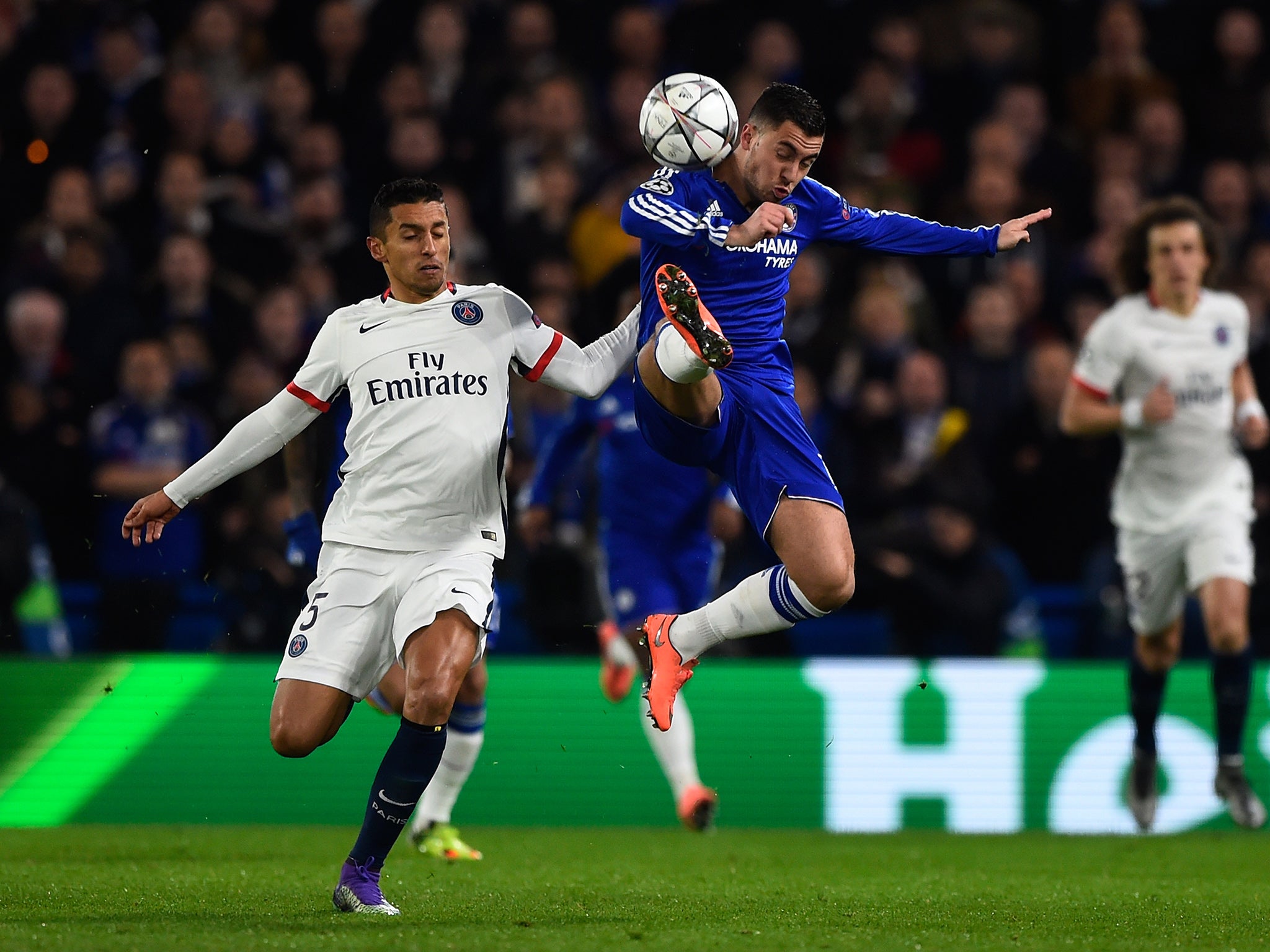 Eden Hazard leaps for the ball against PSG