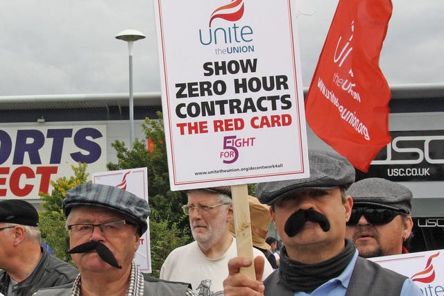 Unite union members dressed as Dickensian workers protesting against zero-hours contracts outside the headquarters of Sports Direct