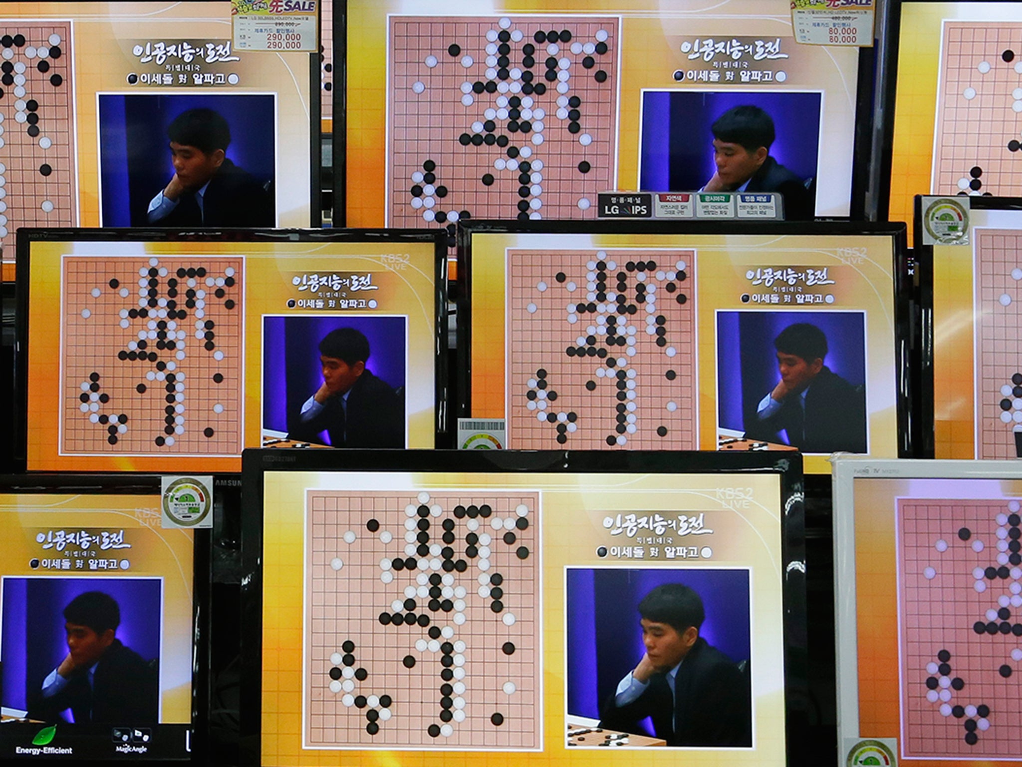 South Korean professional Go player Lee Sedol is seen on TV screens during the Google DeepMind Challenge Match against Google's artificial intelligence program, AlphaGo, at the Yongsan Electronic store in Seoul, South Korea