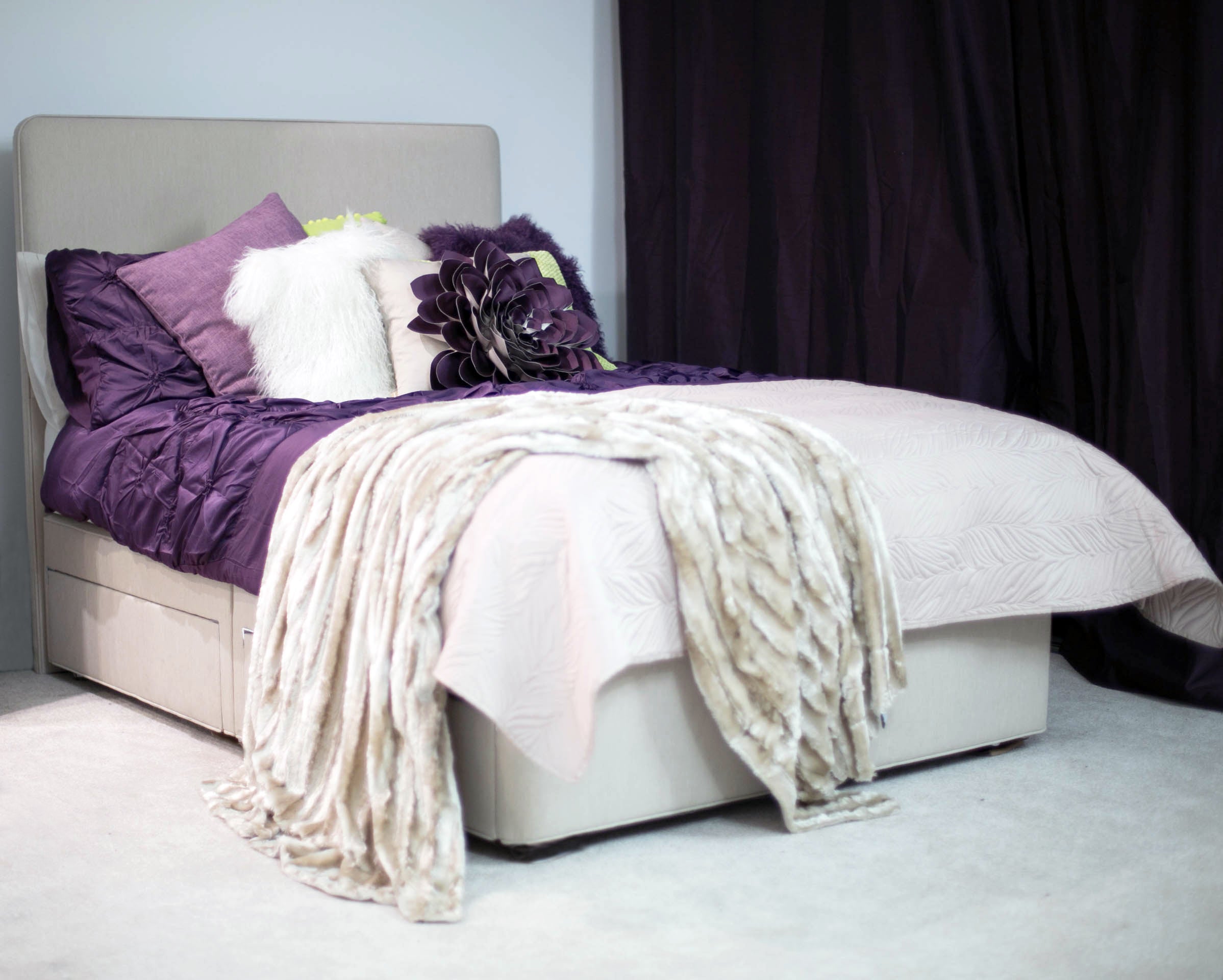 Dressed to impress: purple, green and cream bedding translates neatly between the season