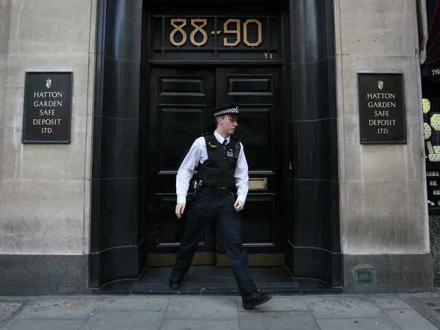 A policeman emerges from a Hatton Garden safe deposit centre on April 7, 2015 in London, England