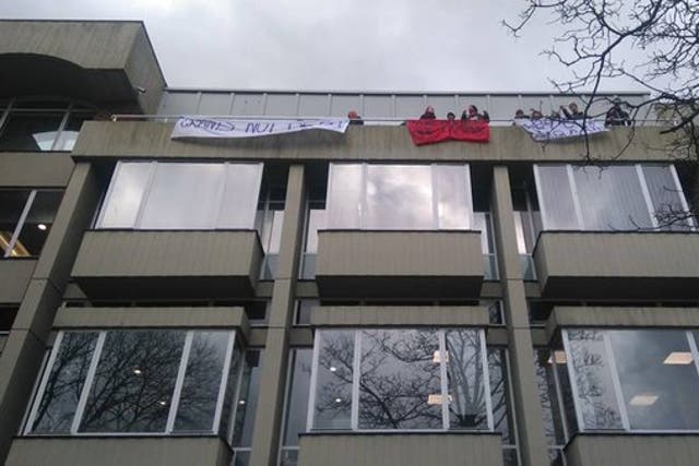 The protesters pictured on the balcony of Bramber House on Thursday morning