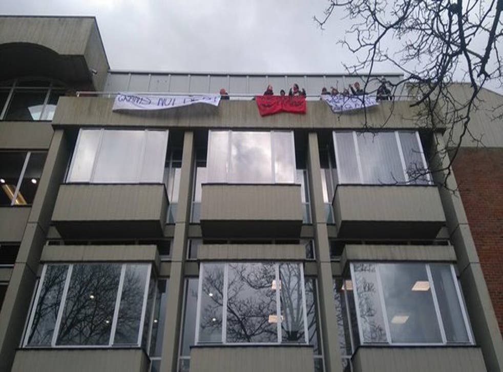 The protesters pictured on the balcony of Bramber House on Thursday morning