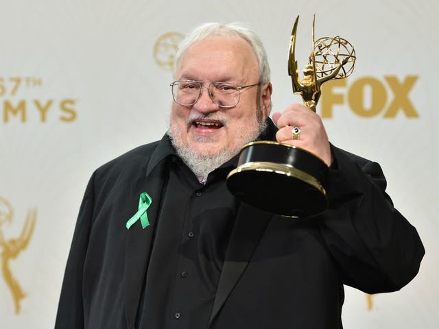George RR Martin holds up his 2015 Emmy for Outstanding Drama Series for Game of Thrones