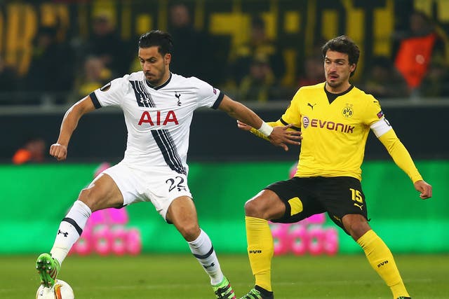 Nacer Chadli and Mats Hummels battle for the ball