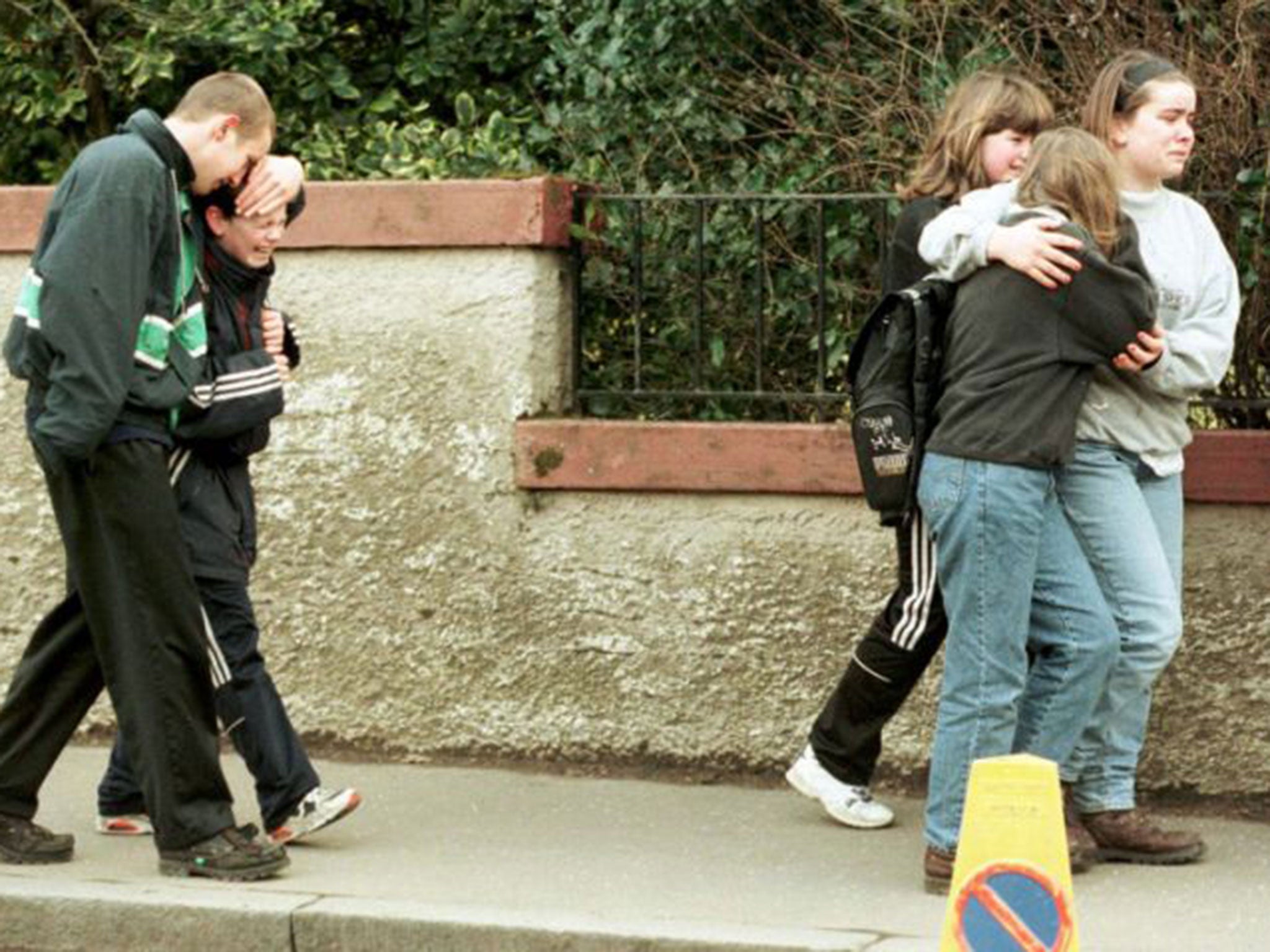 &#13;
Grieving pupils the day after the massacre &#13;