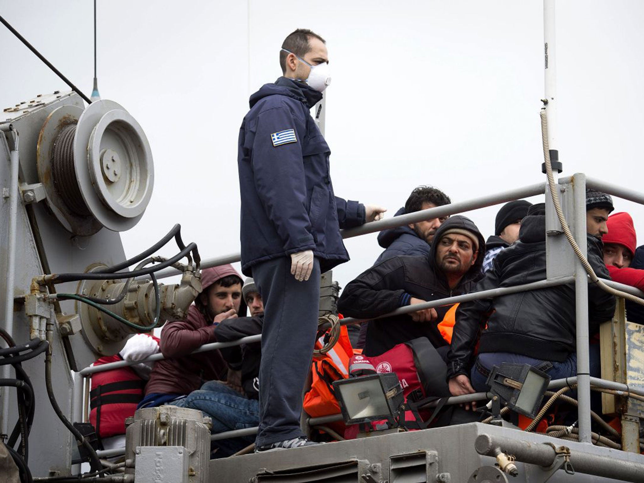 Refugees on the deck of a Greek coast guard boat