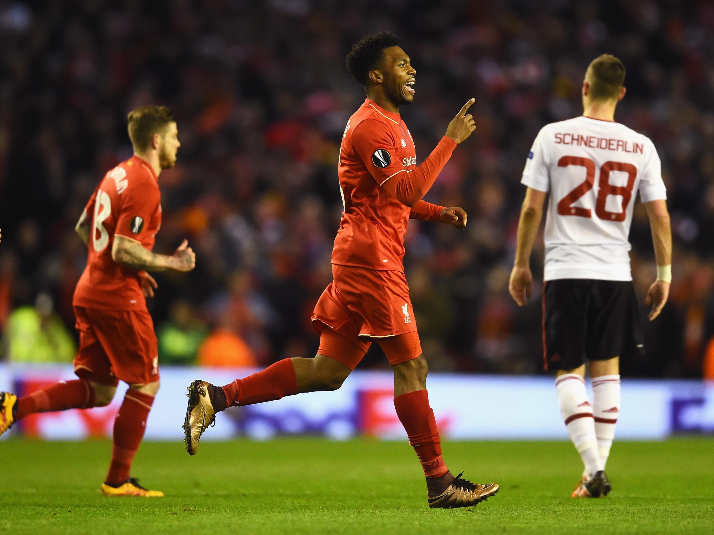 Daniel Sturridge celebrates scoring the opening goal against Manchester United