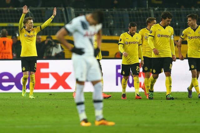 Erik Lamela hangs his head after Dortmund's third goal
